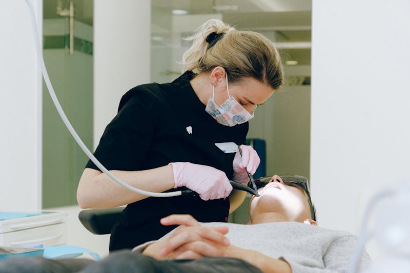 Dentist treating a patient in the chair during an emergency appointment
